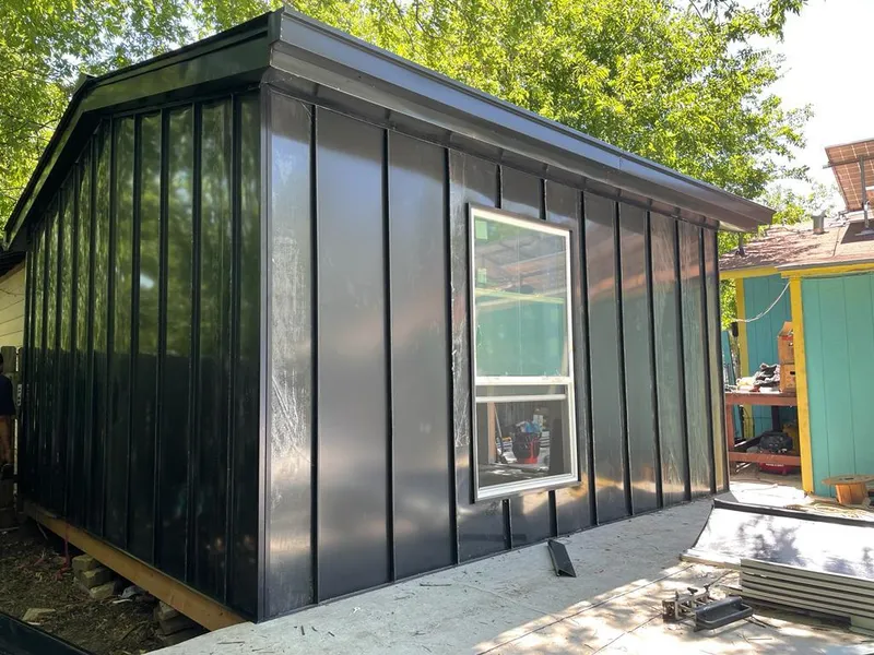 Black standing seam metal wall panels for Roof Inspection in Ardmore